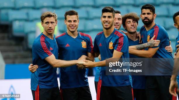 Nacho Monreal, Cesar Azpilicueta, Marco Asensio, Alvaro Odriozola and Diego Costa of Spain laugh during a training session at Fisht Stadium on June...