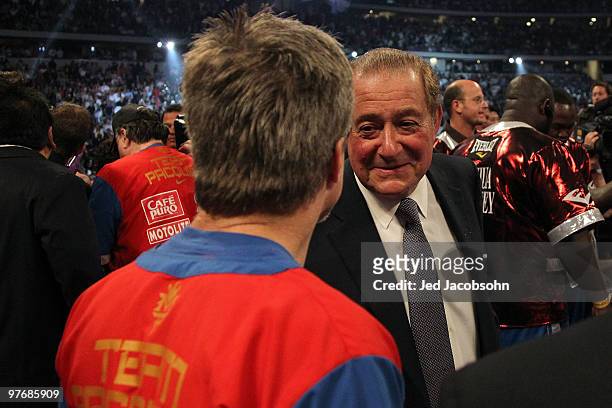 Promoter Bob Arum talks with trainer Freddie Roach, who trains Manny Pacquiao of the Philippines, in the ring after Pacquiao defeated Joshua Clottey...