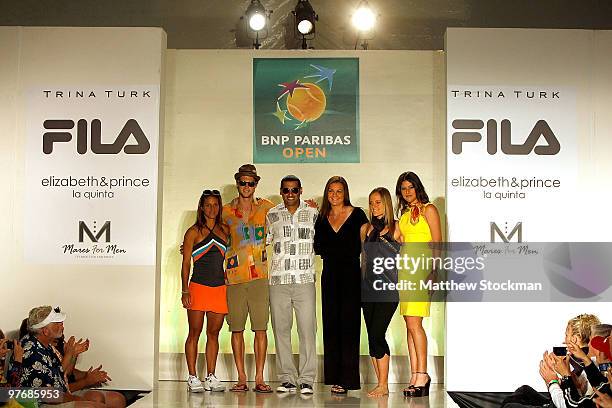 Edina Gallovits, Andreas Seppi, Andy Ram, Agnieszka Radwanska, Agnes Szavay and Sorana Cristea pose for photographers after participating in a...