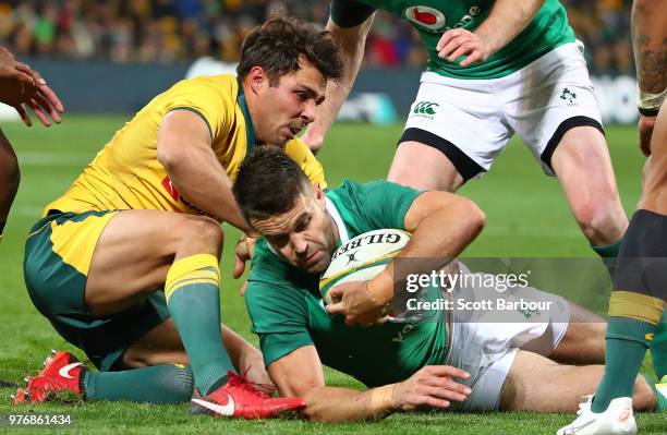 Conor Murray of Ireland is tackled by Nick Phipps of the Wallabies during the International test match between the Australian Wallabies and Ireland...