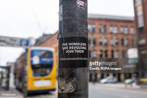 Sticker of the homeless seen on a pole on the street side. Greater Manchester is a remarkable city in the northwest of England with a lush industrial...