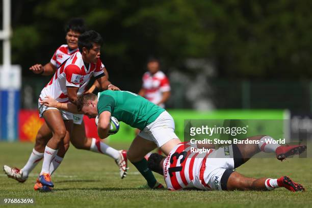 Sean O'Brien of Ireland is tackled by Sioeli Vakalahi of Japan during the World Rugby via Getty Images Under 20 Championship 11th Place play-off...