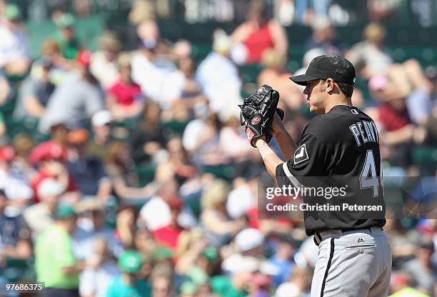 Starting pitcher Jake Peavy of the Chicago White Sox pitches against the Los Angeles Angels of Anaheim during the MLB spring training game at Tempe...