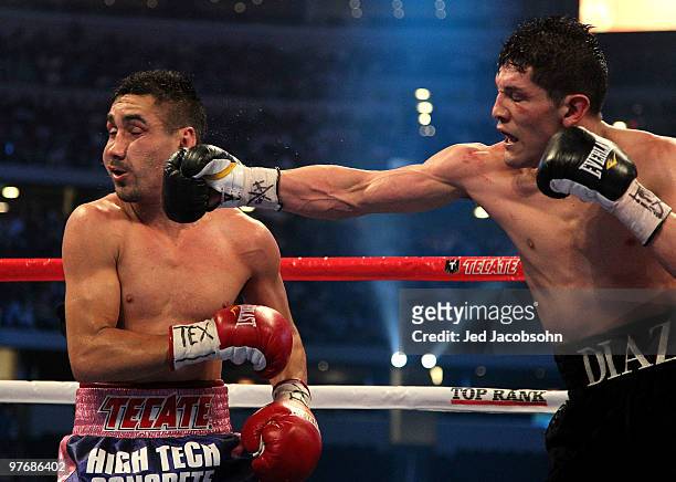 David Diaz connects with a right to the face of Humberto Soto of Mexico during the WBC lightweight title fight at Cowboys Stadium on March 13, 2010...