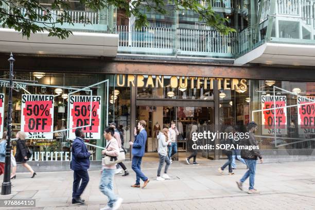 Big sale seen on the front window of Urban Outfitters in Manchester. Greater Manchester is a remarkable city in the northwest of England with a rich...