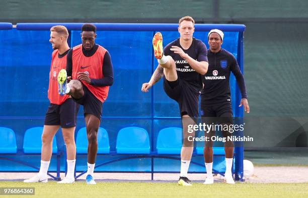 Danny Welbeck and Phil Jones of England stretch during a training session during the England Media Access at on June 17, 2018 in Saint Petersburg,...