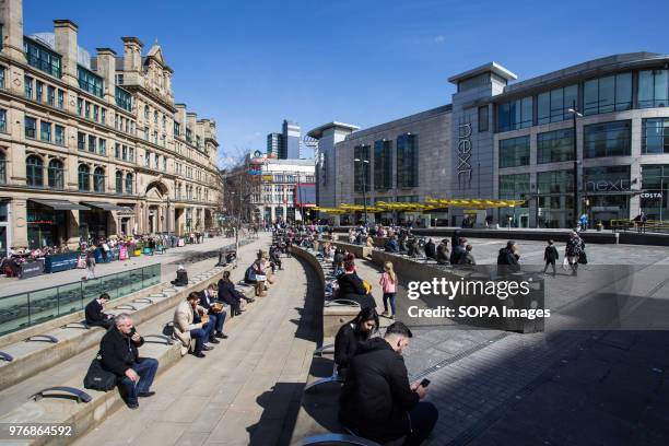 Local people seen enjoying the sunny day in Manchester city center. Greater Manchester is a remarkable city in the northwest of England with a rich...