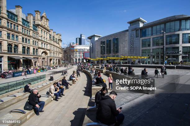 Local people seen enjoying the sunny day in Manchester city center. Greater Manchester is a remarkable city in the northwest of England with a rich...