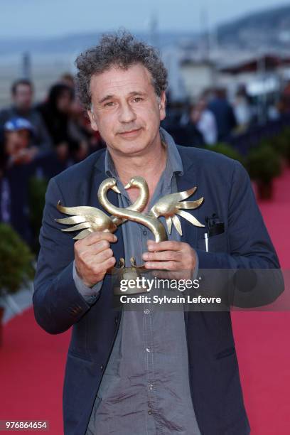 Winner of the Gonzagues Saint-Bris Award Emmanuel Finkiel attends the winners' red carpet of Cabourg Film Festival on June 16, 2018 in Cabourg,...