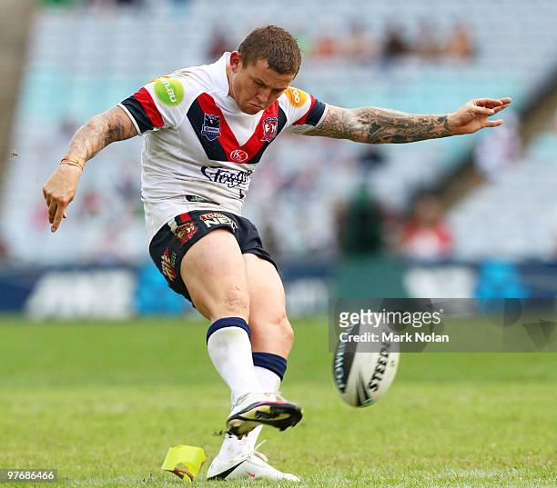Todd Carney of the Roosters kicks for goal during the round one NRL match between the South Sydney Rabbitohs and the Sydney Roosters at ANZ Stadium...