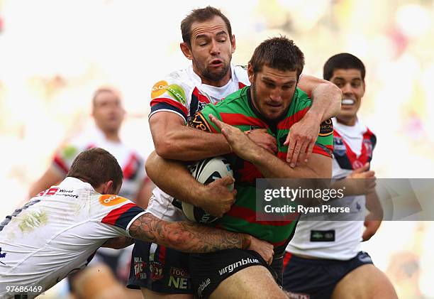 David Taylor of the Rabbitohs is tackled by Phil Graham of the Roosters during the round one NRL match between the South Sydney Rabbitohs and the...