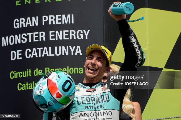 Honda Leopard Racing Italian's rider Ena Bastianini celebrates on the podium after winning the Catalunya Moto3 Grand Prix race at the Catalunya...