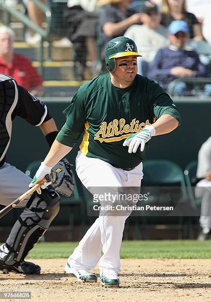 Jack Cust of the Oakland Athletics bats against the Chicago White Sox during the MLB spring training game at Phoenix Municipal Stadium on March 10,...