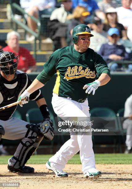 Jack Cust of the Oakland Athletics bats against the Chicago White Sox during the MLB spring training game at Phoenix Municipal Stadium on March 10,...