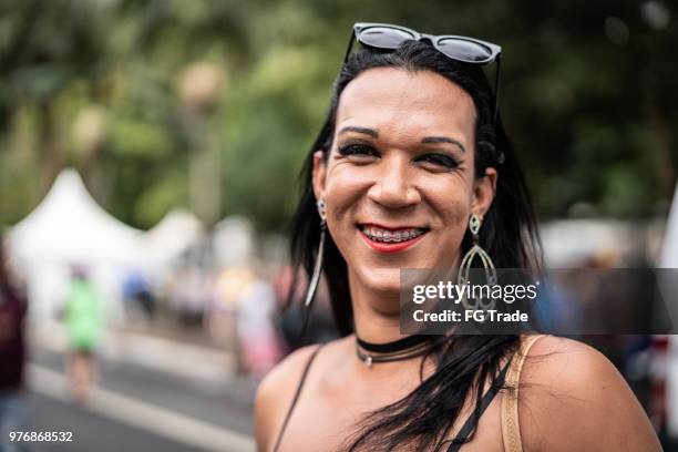 cross dressing man wearing the clothing of woman gender figures - adult braces stock pictures, royalty-free photos & images