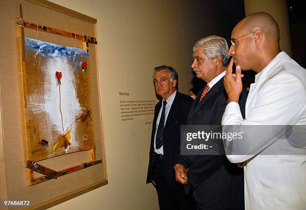 Libyan architect and artist Seif al-Islam Kadhafi , son of Libya's leader Moammer Kadhafi, stands in front of one of his art works at the opening of...