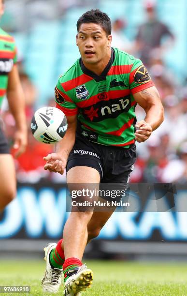 Isaac Luke of the Rabbitohs passes the ball during the round one NRL match between the South Sydney Rabbitohs and the Sydney Roosters at ANZ Stadium...