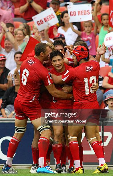 Anthony Faingaa of the Reds celebrates after scoring a try during the round five Super 14 match between the Reds and the Western Force at Suncorp...