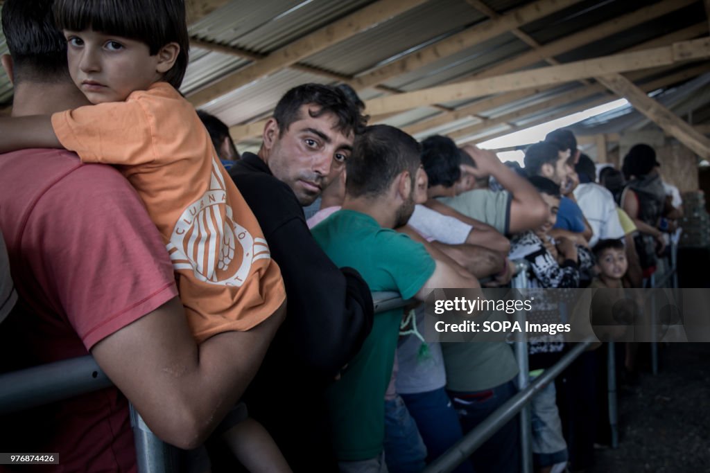 People queueing for food aid provided by the UNHCR at a