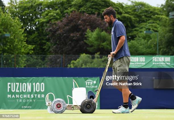 Ground staff prepare for Day 8 of the Fuzion 100 Manchester Trophy at The Northern Lawn Tennis Club on June 17, 2018 in Manchester, United Kingdom.