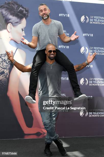 Shemar Moore carries on his shoulder Jay Harrington from the serie "S.W.A.T" at photocall during the 58th Monte Carlo TV Festival on June 17, 2018 in...