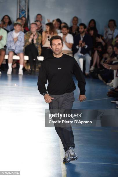 Fashion designer Massimo Giorgetti acknowledges the audience on the runway at the MSGM show during Milan Men's Fashion Week Spring/Summer 2019 on...