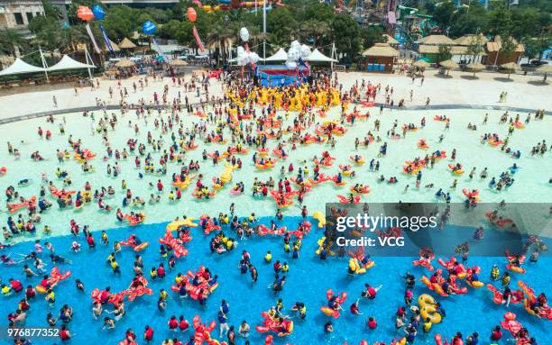 People play with crayfish inflatables at Playa Maya water park on June 17, 2018 in Wuhan, Hubei Province of China.