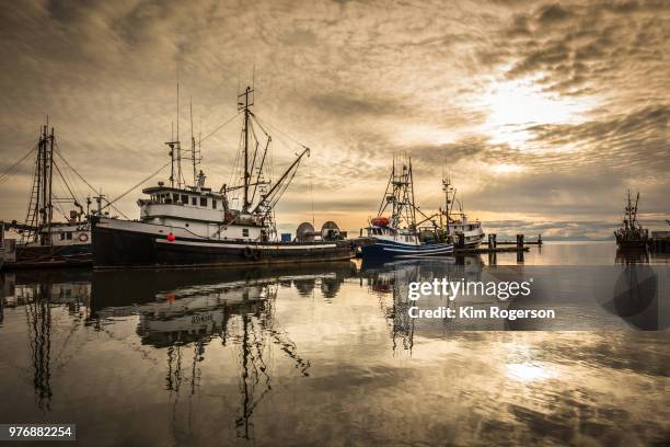 steveston marina fishing vessel with dramatic sky - bc commercial fishing boats stock pictures, royalty-free photos & images