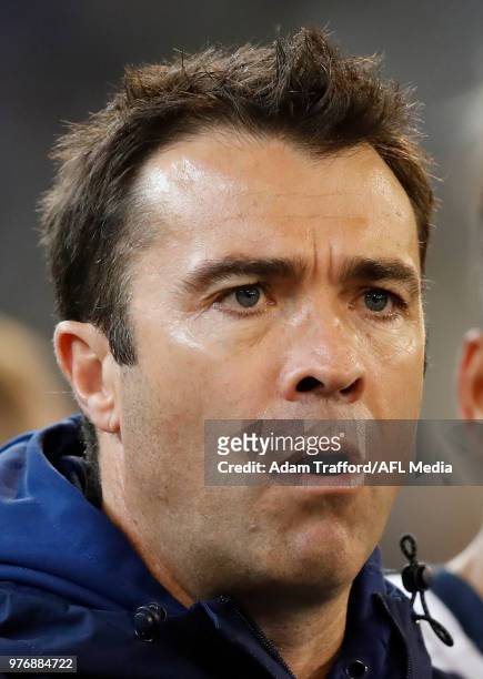 Chris Scott, Senior Coach of the Cats addresses his players during the 2018 AFL round 13 match between the Geelong Cats and the Richmond Tigers at...