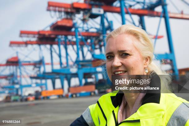 April 2018, Germany, Hamburg: Angela Titzrath, CEO of Hamburger Hafen und Logistik AG , stands next to the Containerterminal Altenwerder during a...