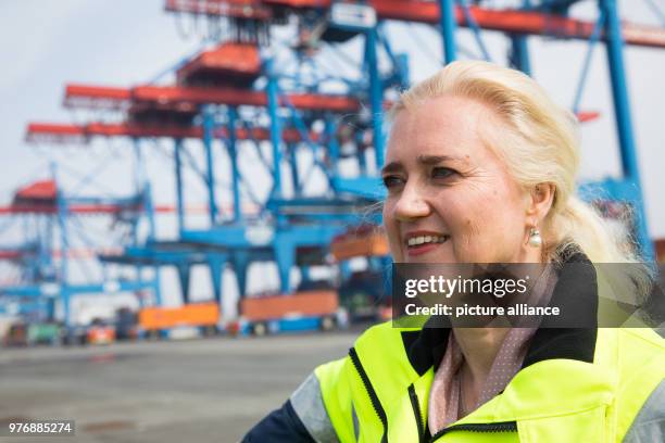 April 2018, Germany, Hamburg: Angela Titzrath, CEO of Hamburger Hafen und Logistik AG , stands next to the Containerterminal Altenwerder during a...