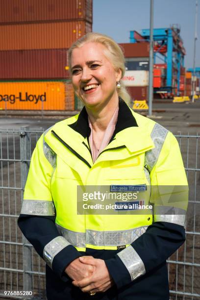 April 2018, Germany, Hamburg: Angela Titzrath, CEO of Hamburger Hafen und Logistik AG , stands next to the Containerterminal Altenwerder during a...