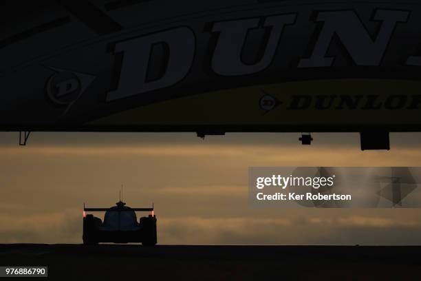 The Algarve Pro Racing Ligier JSP217 of Mark Patterson, Ate De Jong and Tacksung Kim drives under the Dunlop Bridge at dawn during the Le Mans 24...