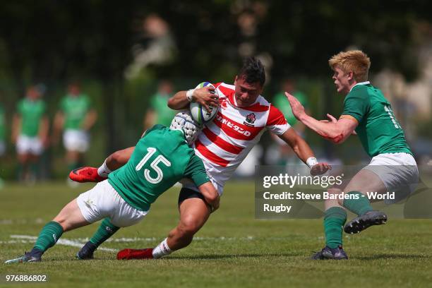 Halatoa Vailea of Japan is tackled by Michael Lowry of Ireland during the World Rugby via Getty Images Under 20 Championship 11th Place play-off...