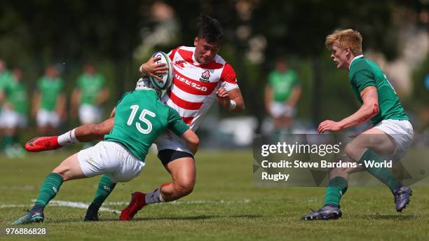 Halatoa Vailea of Japan is tackled by Michael Lowry of Ireland during the World Rugby via Getty Images Under 20 Championship 11th Place play-off...