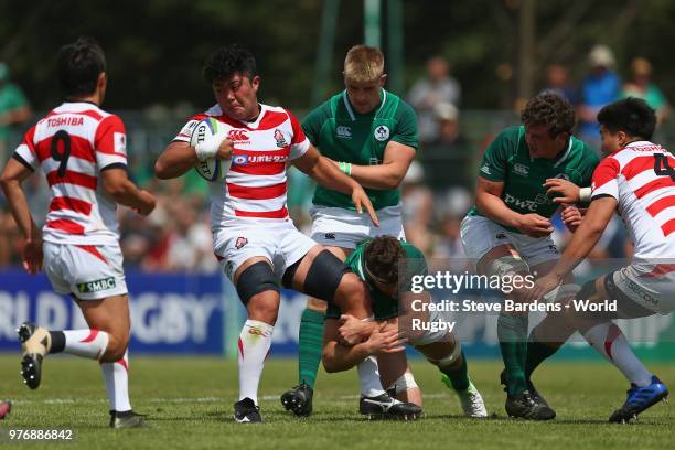 Ryuga Hashimoto of Japan is tackled by the Ireland defence during the World Rugby via Getty Images Under 20 Championship 11th Place play-off match...