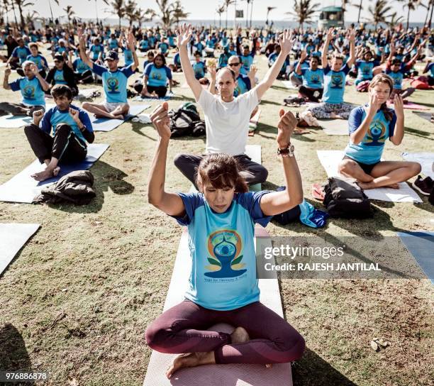 Hundreds of people take part in a yoga session at North Beach on June 17, 2018 in Durban, South Africa, ahead of the International Day of Yoga on...