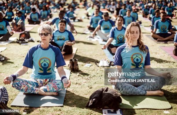 Hundreds of people take part in a yoga session at North Beach on June 17, 2018 in Durban, South Africa, ahead of the International Day of Yoga on...