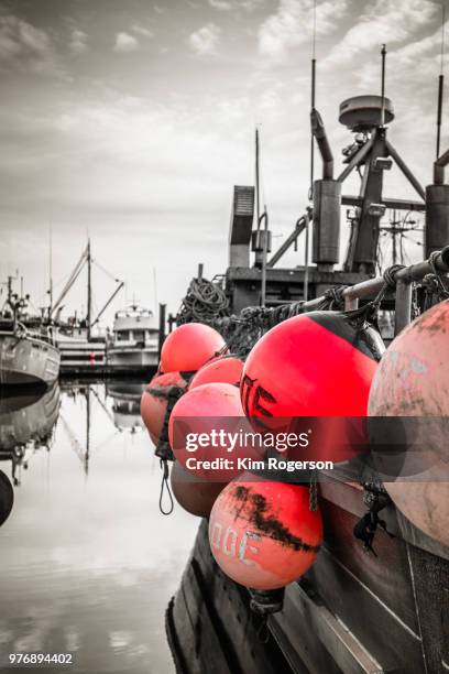 red buoys hang on fishing boat - bc commercial fishing boats stock pictures, royalty-free photos & images