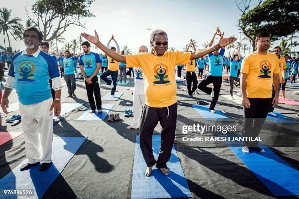 Inkatha Freedom Party founder and South African opposition leader Mnagosuthu Buthelezi take part in a yoga session at North Beach on June 17, 2018 in...