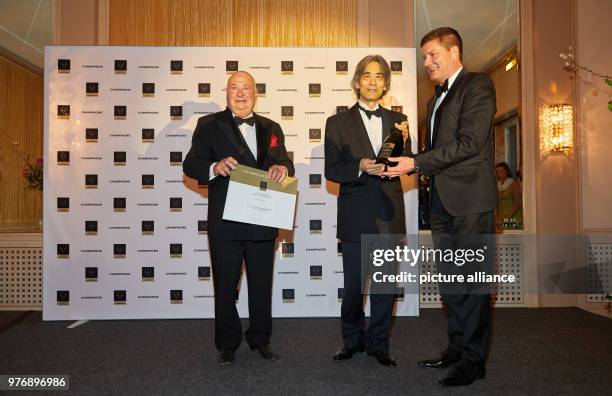 April 2018, Hamburg, Germany: Guenter Schoeneis, founder of the award and panel member , award winner Kent Nagano, and Christian Josephi, host and...