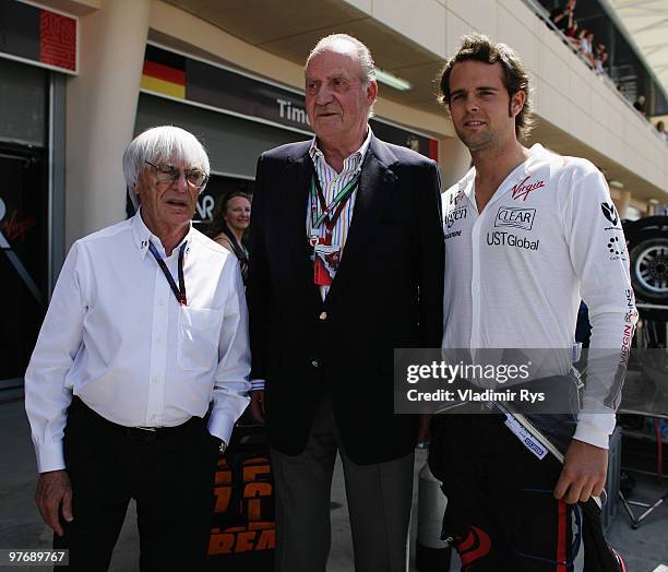 King Juan Carlos of Spain meets Andy Soucek of Spain and Virgin GP and F1 supremo Bernie Ecclestone before the Bahrain Formula One Grand Prix at the...