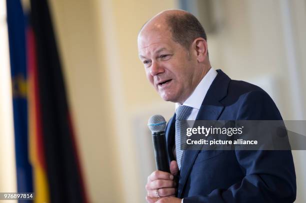 German Finance Minister Olaf Scholz speaks during a press conference to present the annual report of the German customs at the Finance ministry, in...