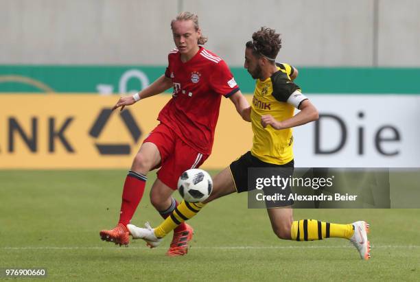 Ryan Johansson of FC Bayern Muenchen fights for the ball with Alaa Bakir of Borussia Dortmund during the B Juniors German Championship final between...