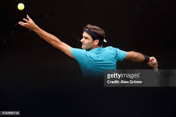 Roger Federer of Switzerland serves the ball to Milos Raonic of Canada during the final match on day 7 of the Mercedes Cup at Tennisclub Weissenhof...