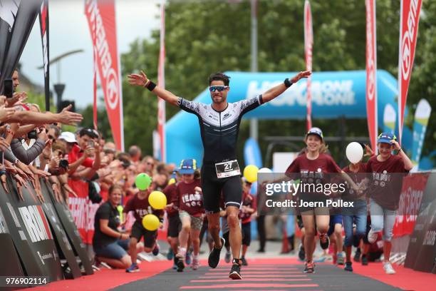 Manuel Kueng of Switzerland celebrates winning the IRONMAN 70.3 Luxembourg-Region Moselle race on June 17, 2018 in Luxembourg, Luxembourg.