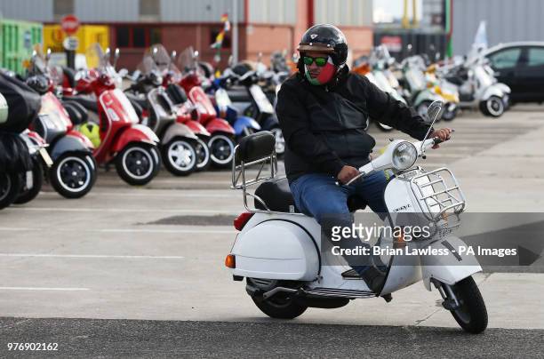Vespa enthusiasts arrive for the gala dinner in Belfast as thousands of Vespa scooter drivers have descended on Northern Ireland as part of the Vespa...
