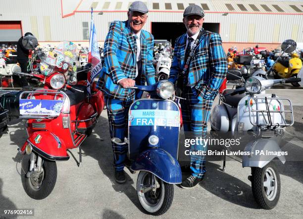 Vespa enthusiasts arrive for the gala dinner in Belfast as thousands of Vespa scooter drivers have descended on Northern Ireland as part of the Vespa...