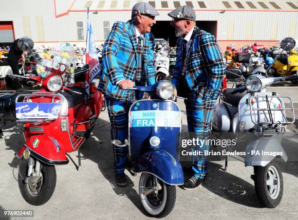 Vespa enthusiasts arrive for the gala dinner in Belfast as thousands of Vespa scooter drivers have descended on Northern Ireland as part of the Vespa...