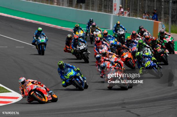 Repsol Honda Team's Spanish rider Marc Marquez leads the pack at the start of the Catalunya Moto GP Grand Prix race at the Catalunya racetrack in...